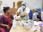 A relative of yesterday's Air India plane crash victim gives her DNA sample for identification of bodies at a hospital in Ahmedabad.