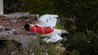 A tail of an Air India Boeing 787 Dreamliner plane that crashed is seen stuck on a building after the incident in Ahmedabad, India, June 12, 2025. (Reuters)