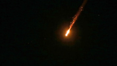 A projectile fired from Iran toward Israel is intercepted over Amman on June 13, 2025. (AFP)