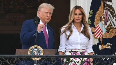 US President Donald Trump (L) raises a fist, flanked by US First Lady Melania Trump, after addressing attendees during in the Congressional Picnic on the South Lawn of the White House in Washington, DC, on June 12, 2025. (Photo by SAUL LOEB / AFP) (AFP) US President Donald Trump (L) raises a fist, flanked by US First Lady Melania Trump, after addressing attendees during in the Congressional Picnic on the South Lawn of the White House in Washington, DC, on June 12, 2025. (Photo by SAUL LOEB / AFP) (AFP)