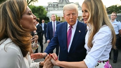 US First Lady Melania Trump (R) and US President Donald Trump greet attendees at the Congressional Picnic on the South Lawn of the White House in Washington, DC, on June 12, 2025. (Photo by SAUL LOEB / AFP) (AFP) US First Lady Melania Trump (R) and US President Donald Trump greet attendees at the Congressional Picnic on the South Lawn of the White House in Washington, DC, on June 12, 2025. (Photo by SAUL LOEB / AFP) (AFP)
