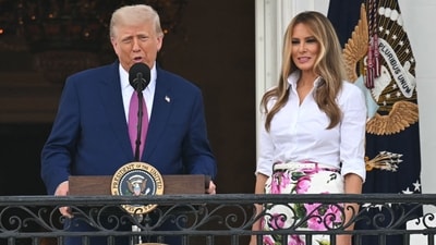 US President Donald Trump (L), flanked by US First Lady Melania Trump, addresses attendees during in the Congressional Picnic on the South Lawn of the White House in Washington, DC, on June 12, 2025. (Photo by SAUL LOEB / AFP) (AFP) US President Donald Trump (L), flanked by US First Lady Melania Trump, addresses attendees during in the Congressional Picnic on the South Lawn of the White House in Washington, DC, on June 12, 2025. (Photo by SAUL LOEB / AFP) (AFP)