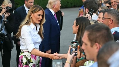 US President Donald Trump (2L) and US First Lady Melania Trump greet attendees as they arrive at the Congressional Picnic on the South Lawn of the White House in Washington, DC, on June 12, 2025. (Photo by SAUL LOEB / AFP) (AFP) US President Donald Trump (2L) and US First Lady Melania Trump greet attendees as they arrive at the Congressional Picnic on the South Lawn of the White House in Washington, DC, on June 12, 2025. (Photo by SAUL LOEB / AFP) (AFP)