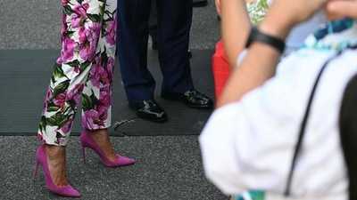 US First Lady Melania Trump (L) and US President Donald Trump's shoes are seen as they greet attendees at the Congressional Picnic on the South Lawn of the White House in Washington, DC, on June 12, 2025. (Photo by SAUL LOEB / AFP) (AFP) US First Lady Melania Trump (L) and US President Donald Trump's shoes are seen as they greet attendees at the Congressional Picnic on the South Lawn of the White House in Washington, DC, on June 12, 2025. (Photo by SAUL LOEB / AFP) (AFP)