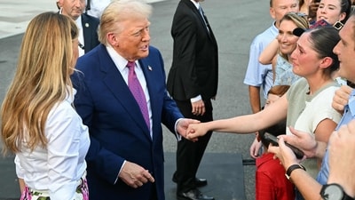 An attendee becomes emotional as she is greeted by US First Lady Melania Trump and US President Donald Trump at the Congressional Picnic on the South Lawn of the White House in Washington, DC, on June 12, 2025. (Photo by SAUL LOEB / AFP) (AFP) An attendee becomes emotional as she is greeted by US First Lady Melania Trump and US President Donald Trump at the Congressional Picnic on the South Lawn of the White House in Washington, DC, on June 12, 2025. (Photo by SAUL LOEB / AFP) (AFP)