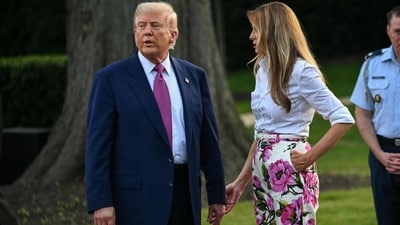 US President Donald Trump (L) and US First Lady Melania Trump attend the Congressional Picnic on the South Lawn of the White House in Washington, DC, on June 12, 2025. (Photo by SAUL LOEB / AFP) (AFP) US President Donald Trump (L) and US First Lady Melania Trump attend the Congressional Picnic on the South Lawn of the White House in Washington, DC, on June 12, 2025. (Photo by SAUL LOEB / AFP) (AFP)
