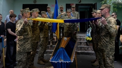 Ukrainian soldiers unwrap the Ukrainian national flag over the coffin of a 21-year-old Ukrainian serviceman who was killed in the battle near the Zaporizhzhia direction, during the funeral ceremony in Kyiv on June 2, 2025. (AFP) Ukrainian soldiers unwrap the Ukrainian national flag over the coffin of a 21-year-old Ukrainian serviceman who was killed in the battle near the Zaporizhzhia direction, during the funeral ceremony in Kyiv on June 2, 2025. (AFP)