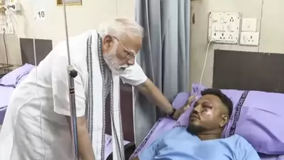 PM Modi with lone survivor Vishwash Kumar Ramesh PM Modi with lone survivor Vishwash Kumar Ramesh