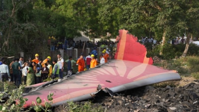 People near the debris of the Air India plane that crashed moments after taking off from the Sardar Vallabhbhai Patel international airport, in Ahmedabad, on Thursday. (AP) People near the debris of the Air India plane that crashed moments after taking off from the Sardar Vallabhbhai Patel international airport, in Ahmedabad, on Thursday. (AP)