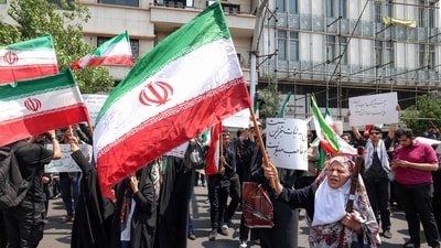 People gather for a protest against Israel's wave of strikes on Iran in central Tehran on June 13. (AFP) People gather for a protest against Israel's wave of strikes on Iran in central Tehran on June 13. (AFP)