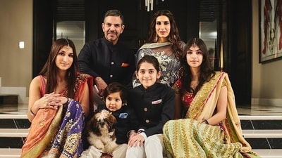Sanjay Kapur with wife Priya and their kids.