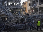 Israeli security forces inspect destroyed residential buildings that were hit by a missile fired from Iran, in Ramat Gan, near Tel Aviv, Israel, on Saturday, June 14, 2025.
