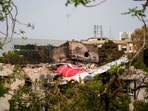 Remains of the crashed Air India plane lie on a building, in Ahmedabad, Saturday, June 14, 2025.