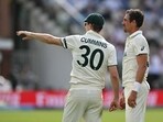 Australia's captain Pat Cummins (L) and Australia's Mitchell Starc (R) talk on day three. Australia's captain Pat Cummins (L) and Australia's Mitchell Starc (R) talk on day three.