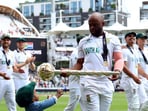 Temba Bavuma takes a lap of honour with his son, celebrating with his teammates and his family after becoming the South African captain to end their long-time curse of falling just short at the ultimate stage.