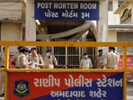 Policemen stand guard outside the post mortem room, where the bodies of the victims who died after the Air India Boeing 787-8 Dreamliner plane bound for London's Gatwick Airport crashed during take-off from Ahmedabad have been kept, at a hospital, in Ahmedabad, India June 14, 2025.