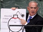 Israel's Prime Minister Benjamin Netanyahu points to a red line he drew on the graphic of a bomb used to represent Iran's nuclear programme as he addresses the 67th United Nations General Assembly at the UN Headquarters in New York, September 27, 2012. 