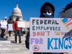 A federal employee, who asked not to use their name for fears over losing their job, protests with a sign saying 'Federal Employees Don't Work for Kings' during the 'No Kings Day' protest on Presidents Day near the Capitol in Washington. A federal employee, who asked not to use their name for fears over losing their job, protests with a sign saying 'Federal Employees Don't Work for Kings' during the 'No Kings Day' protest on Presidents Day near the Capitol in Washington.