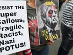 People hold placards during a No Kings Day protest against U.S. President Donald Trump's policies, in Philadelphia, Pennsylvania, U.S., June 14, 2025. REUTERS/Lee Smith