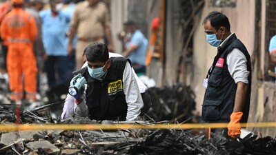 In Ahmedabad, forensic experts searching for evidence at Air India Plane crash site. More than 240 people lost their lives when an Air India flight bound for London crashed just moments after taking off from Ahmedabad Airport. (HT Photo/Raju Shinde)