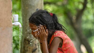 A child splashes herself with water on a hot Saturday in the city. (RAJ K RAJ /HT PHOTO) A child splashes herself with water on a hot Saturday in the city. (RAJ K RAJ /HT PHOTO)
