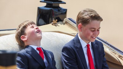 Britain's Prince George and Prince Louis react as they ride a carriage with Britain's Catherine, Princess of Wales, and Princess Charlotte (not pictured) as part of the Trooping the Colour parade which honours Britain's King Charles on his official birthday, in London, Britain, June 14, 2025. REUTERS/Isabel Infantes (REUTERS)