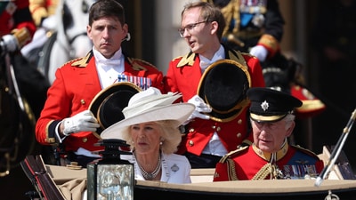 Britain's King Charles and Queen Camilla ride in a carriage, as part of the Trooping the Colour parade to honour Britain's King Charles on his official birthday in London, Britain, June 14, 2025. REUTERS/Toby Melville (REUTERS)