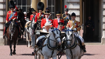 Britain's King Charles and Queen Camilla ride in a carriage, as part of the Trooping the Colour parade to honour Britain's King Charles on his official birthday in London, Britain, June 14, 2025. REUTERS/Toby Melville (REUTERS)