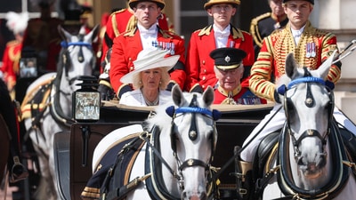 Britain's King Charles and Queen Camilla ride in a carriage, as part of the Trooping the Colour parade to honour Britain's King Charles on his official birthday in London, Britain, June 14, 2025. REUTERS/Toby Melville (REUTERS)