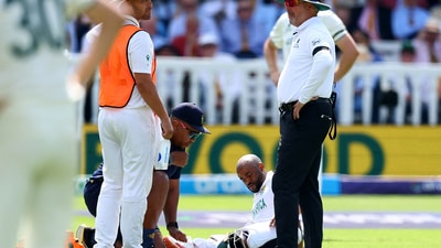 South Africa's Temba Bavuma gets medical attention after sustaining an injury. (Action Images via Reuters)