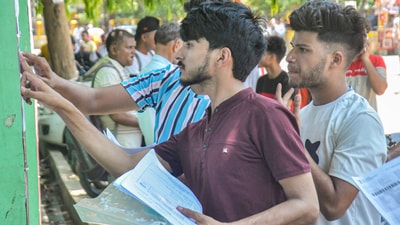 Candidates check notice board for their allotted seats before appearing for the NEET UG exam, at an examination centre in Moradabad. (PTI) Candidates check notice board for their allotted seats before appearing for the NEET UG exam, at an examination centre in Moradabad. (PTI)