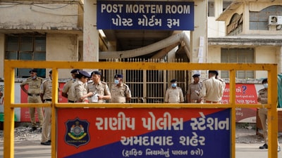 Policemen stand guard outside the post mortem room, where the bodies of the victims who died after the Air India Boeing 787-8 Dreamliner plane bound for London's Gatwick Airport crashed during take-off from Ahmedabad have been kept, at a hospital, in Ahmedabad, India June 14, 2025. (Reuters)