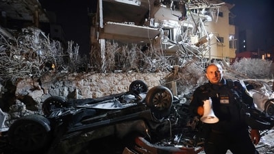 Israel's firefighting service said its teams were responding to the aftermath of Iranian missile strikes. (AFP) Israel's firefighting service said its teams were responding to the aftermath of Iranian missile strikes. (AFP)