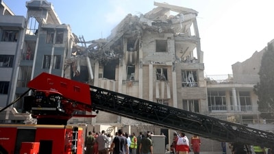 Rescue teams work outside a heavily damaged building, targeted by an Israeli strike in the Iranian capital Tehran. (AFP) Rescue teams work outside a heavily damaged building, targeted by an Israeli strike in the Iranian capital Tehran. (AFP)