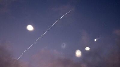 This photo shows rocket trails and intercepts in the sky over the Israeli city of Netanya on June 14, 2025. Iran struck Israel early June 14 with barrages of missiles after a massive onslaught targeted the Islamic republic's nuclear and military facilities. (AFP) This photo shows rocket trails and intercepts in the sky over the Israeli city of Netanya on June 14, 2025. Iran struck Israel early June 14 with barrages of missiles after a massive onslaught targeted the Islamic republic's nuclear and military facilities. (AFP)