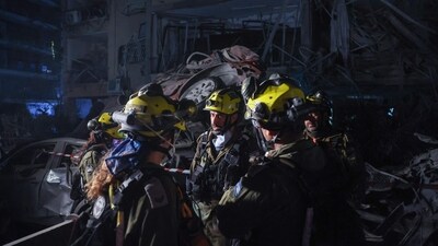 Members of the Israeli security forces inspect a site hit by a missile fired from Iran, in Ramat Gan on the outskirts of Tel Aviv. (Jack Guez/AFP) Members of the Israeli security forces inspect a site hit by a missile fired from Iran, in Ramat Gan on the outskirts of Tel Aviv. (Jack Guez/AFP)
