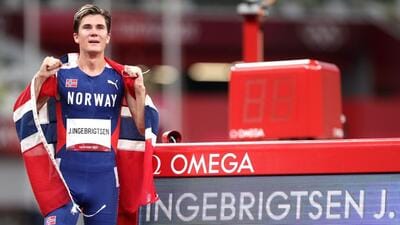 Jakob Ingebrigtsen of Norway drapes himself with the national flag after winning gold medal at Tokyo Olympics. (REUTERS) Jakob Ingebrigtsen of Norway drapes himself with the national flag after winning gold medal at Tokyo Olympics. (REUTERS)