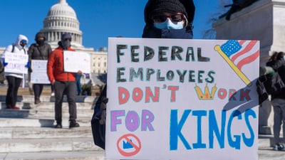 A federal employee, who asked not to use their name for fears over losing their job, protests with a sign saying "Federal Employees Don't Work for Kings" during the "No Kings Day" protest on Presidents Day , Feb. 17, 2025, near the Capitol in Washington. (AP Photo/Jacquelyn Martin, File) (AP) A federal employee, who asked not to use their name for fears over losing their job, protests with a sign saying "Federal Employees Don't Work for Kings" during the "No Kings Day" protest on Presidents Day , Feb. 17, 2025, near the Capitol in Washington. (AP Photo/Jacquelyn Martin, File) (AP)