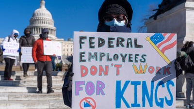 A federal employee, who asked not to use their name for fears over losing their job, protests with a sign saying 'Federal Employees Don't Work for Kings' during the 'No Kings Day' protest on Presidents Day near the Capitol in Washington. (AP File Photo) A federal employee, who asked not to use their name for fears over losing their job, protests with a sign saying 'Federal Employees Don't Work for Kings' during the 'No Kings Day' protest on Presidents Day near the Capitol in Washington. (AP File Photo)