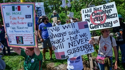 Demonstrators protest against the Trump administration during the "No Kings" rally near US President Donald Trump's Mar-a-Lago home in West Palm Beach, Florida, on June 14, 2025. (AFP) Demonstrators protest against the Trump administration during the "No Kings" rally near US President Donald Trump's Mar-a-Lago home in West Palm Beach, Florida, on June 14, 2025. (AFP)
