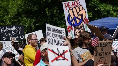 People carry placards with them to advocate for peace, justice and liberty. (AFP) People carry placards with them to advocate for peace, justice and liberty. (AFP)