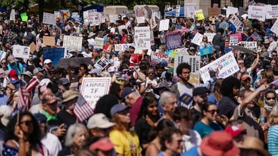 People take part in a "No Kings" protest at Liberty Plaza in Atlanta, Georgia, on June 14, 2025 as US President Donald Trump presides over a military parade in Washington, DC. Trump will preside over a huge military parade in Washington on his 79th birthday, as nationwide protests rejecting his brand of politics underscore deep divisions over his second term. (AFP) People take part in a "No Kings" protest at Liberty Plaza in Atlanta, Georgia, on June 14, 2025 as US President Donald Trump presides over a military parade in Washington, DC. Trump will preside over a huge military parade in Washington on his 79th birthday, as nationwide protests rejecting his brand of politics underscore deep divisions over his second term. (AFP)