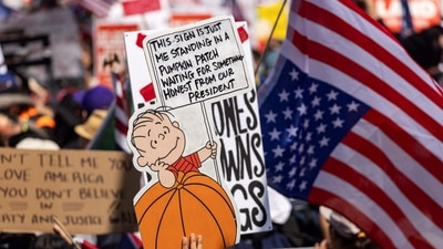 People take part in a "No Kings" protest at City Hall in Los Angeles, California, (AFP) People take part in a "No Kings" protest at City Hall in Los Angeles, California, (AFP)
