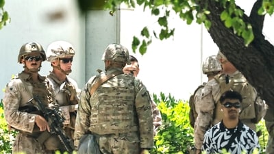 US Marines detain a civilian at the Wilshire Federal Building on June 13, 2025 in Los Angeles, California. A federal appeals court ruled on June 12 that the Trump administration can maintain control of the California National Guard, overturning a lower court ruling that U.S. President Donald Trump's deployment of the troops to protest-laden Los Angeles without Governor Gavin Newsom's consent was unlawful. (Getty Images via AFP) US Marines detain a civilian at the Wilshire Federal Building on June 13, 2025 in Los Angeles, California. A federal appeals court ruled on June 12 that the Trump administration can maintain control of the California National Guard, overturning a lower court ruling that U.S. President Donald Trump's deployment of the troops to protest-laden Los Angeles without Governor Gavin Newsom's consent was unlawful. (Getty Images via AFP)