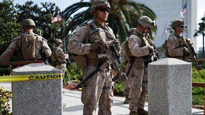 US Marines stand guard at an entrance to the Wilshire Federal Building on June 13, 2025 in Los Angeles, California. (Getty Images via AFP) US Marines stand guard at an entrance to the Wilshire Federal Building on June 13, 2025 in Los Angeles, California. (Getty Images via AFP)