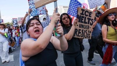 Protesters hold anti-ICE placards in Los Angeles, California. Demonstrations continue after a series of immigration raids began last Friday, June 6th. (Getty Images via AFP) Protesters hold anti-ICE placards in Los Angeles, California. Demonstrations continue after a series of immigration raids began last Friday, June 6th. (Getty Images via AFP)