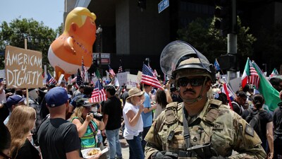A member of the National Guard stands guard as demonstrators take part in the No Kings protest against U.S. President Donald Trump's policies, in Los Angeles, California, U.S., June 14, 2025.  REUTERS/Daniel Cole (REUTERS)