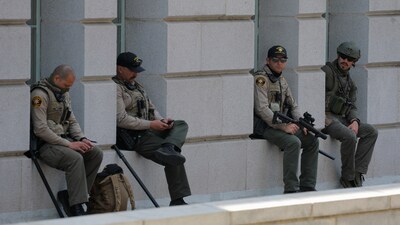 San Luis Obispo County Sheriffs in riot gear sit during a No Kings Day protest against President Donald Trump's policies, in City Hall, in Los Angeles, California, U.S., June 14, 2025.  REUTERS/Mike Blake (REUTERS)