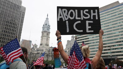 An attendee holds a placard during a No Kings Day protest against U.S. President Donald Trump's policies, in Philadelphia, Pennsylvania, U.S., June 14, 2025. REUTERS/Lee Smith (REUTERS)