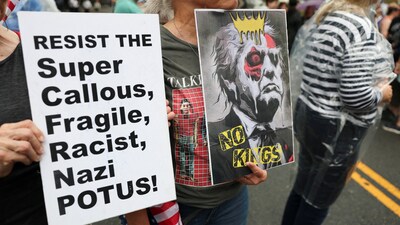People hold placards during a No Kings Day protest against U.S. President Donald Trump's policies, in Philadelphia, Pennsylvania, U.S., June 14, 2025. REUTERS/Lee Smith (REUTERS)